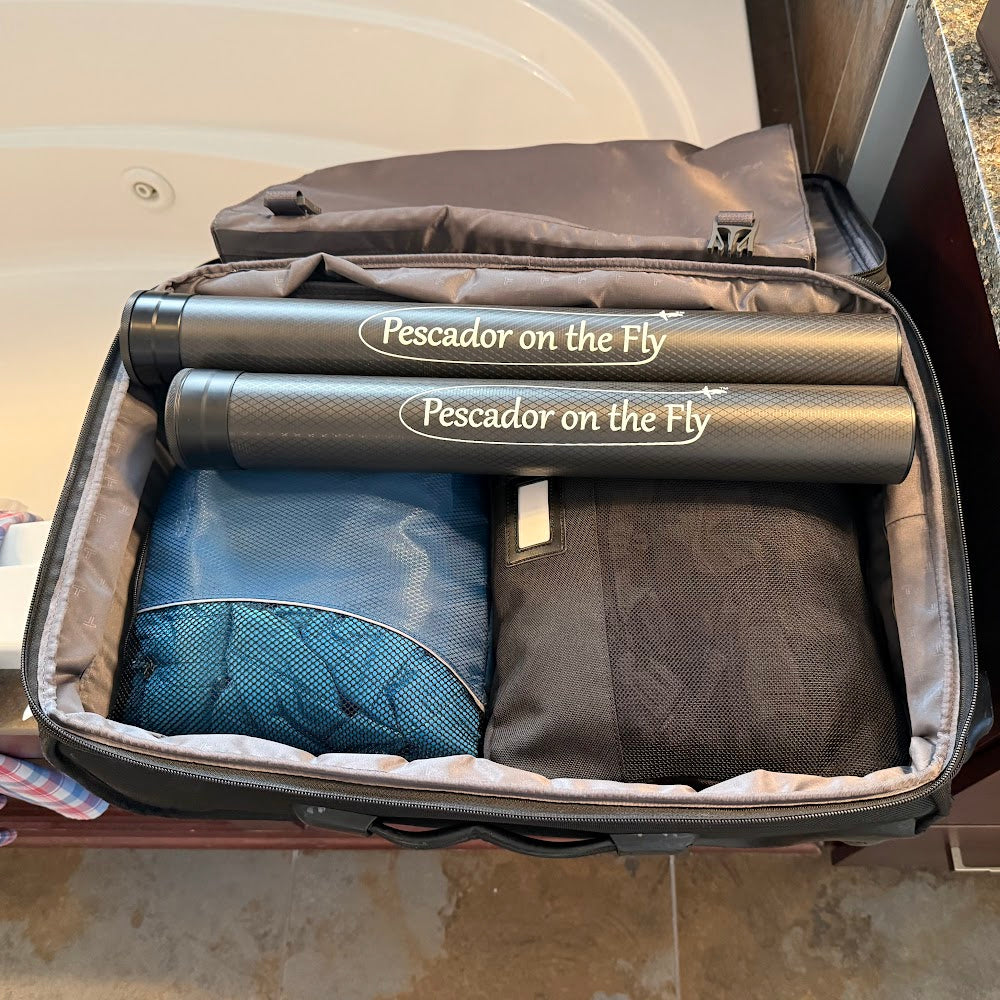 El Rey G6 travel fly rod tube packed in a duffel with gear, ready for travel