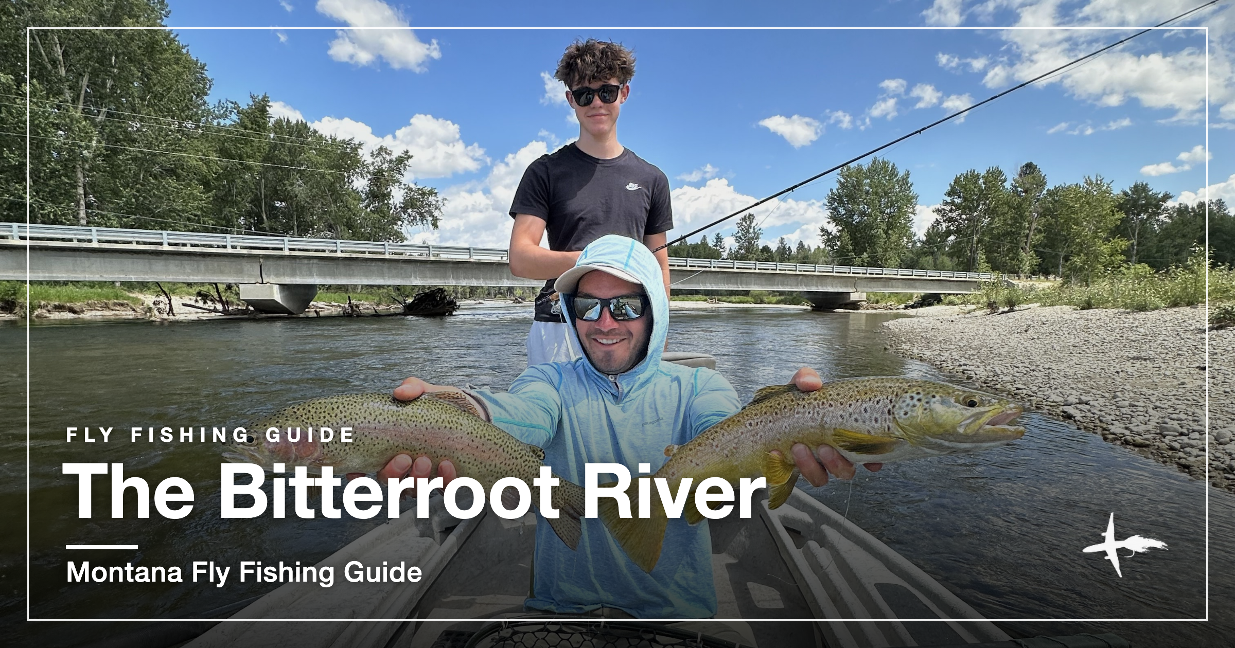 Angler in a drift boat holding a rainbow and a brown trout on the Bitterroot River, Montana